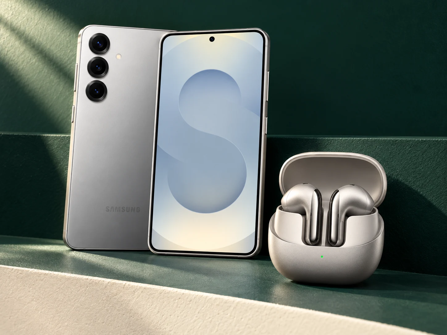 Samsung phone and Xiaomi earbuds in an illustrative technology display
